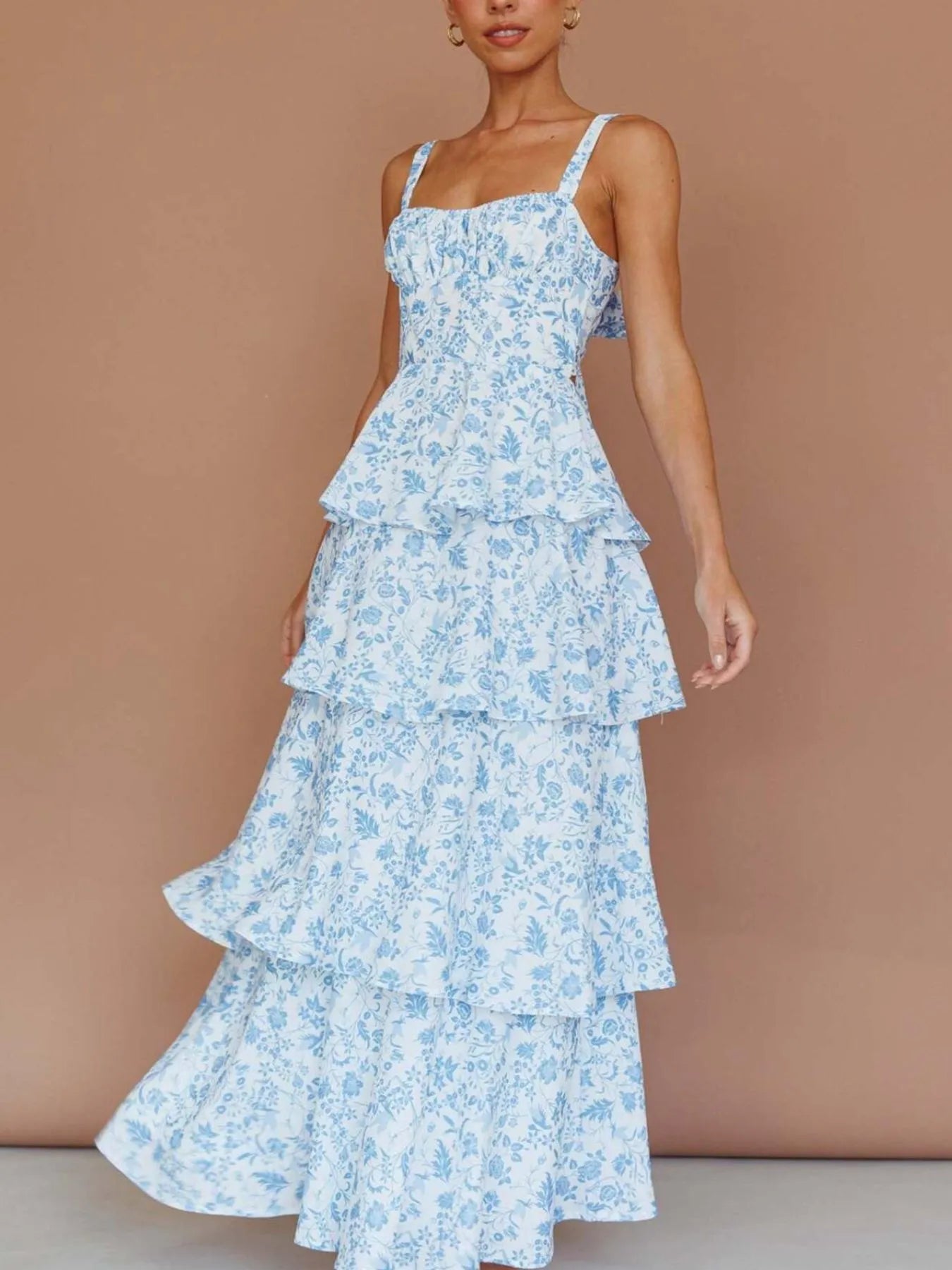 Floral layered ruffle maxi dress by Shopiebay featuring a flowing silhouette with vibrant floral patterns and layered ruffle details.