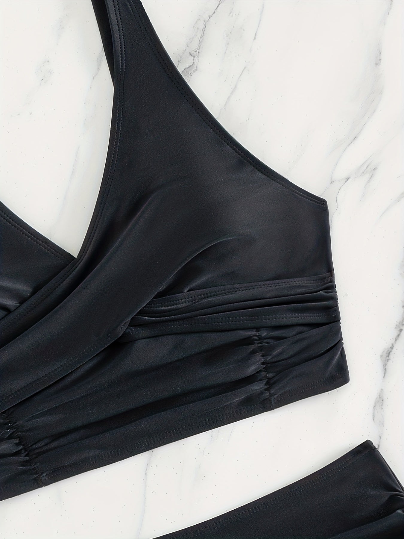 Stevvex black high waist bikini set with twist front, ruched tummy control, cross strap detail, and quick-dry polyamide fabric.