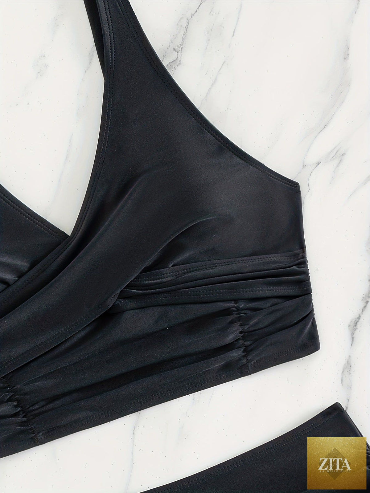 Black Stevvex bikini set with twist front high waist, ruched tummy control, cross strap detail, and quick-drying polyamide fabric.