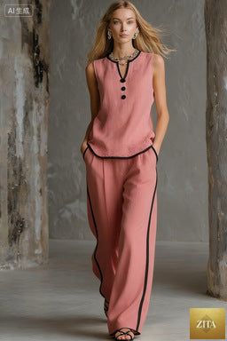 Women's minimalist sleeveless two-piece casualwear set by FitiqueFit, featuring a sleek top and matching pants on a neutral background.