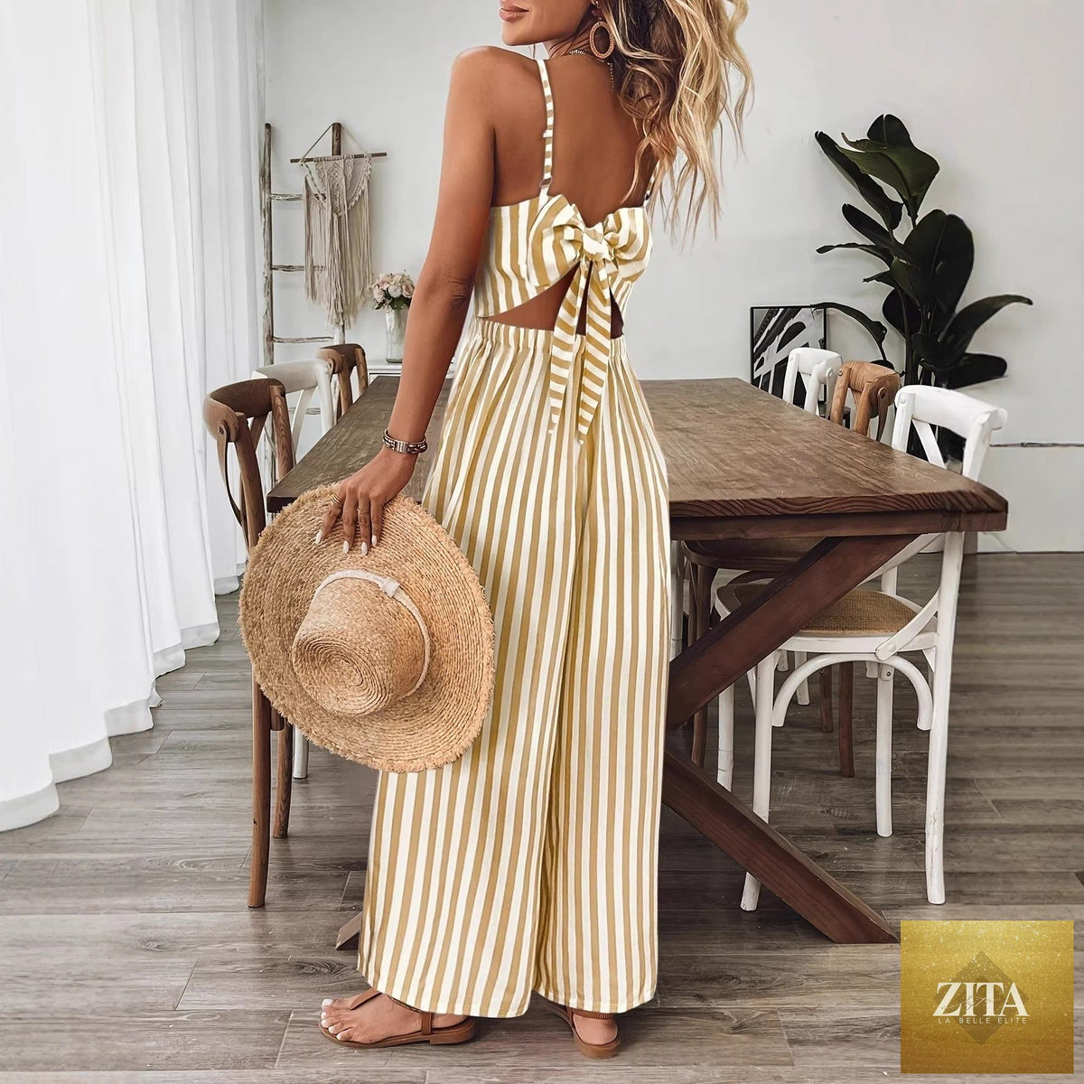 Ginger yellow printed backless sleeveless strap jumpsuit from FitiqueFit, featuring a stylish backless design and relaxed fit.