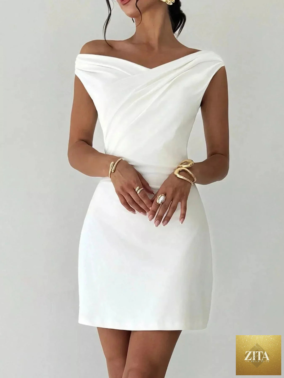 Elegant off-shoulder draped mini dress from Shopiebay featuring a stylish silhouette and flowing fabric for a chic look.