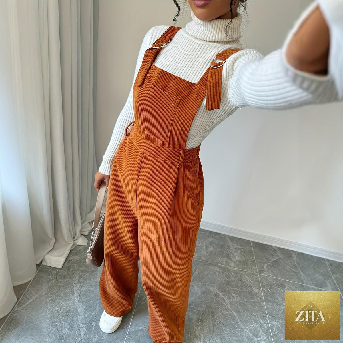 Women’s corduroy loose straight bib pants in a neutral color, featuring a relaxed fit and adjustable straps.