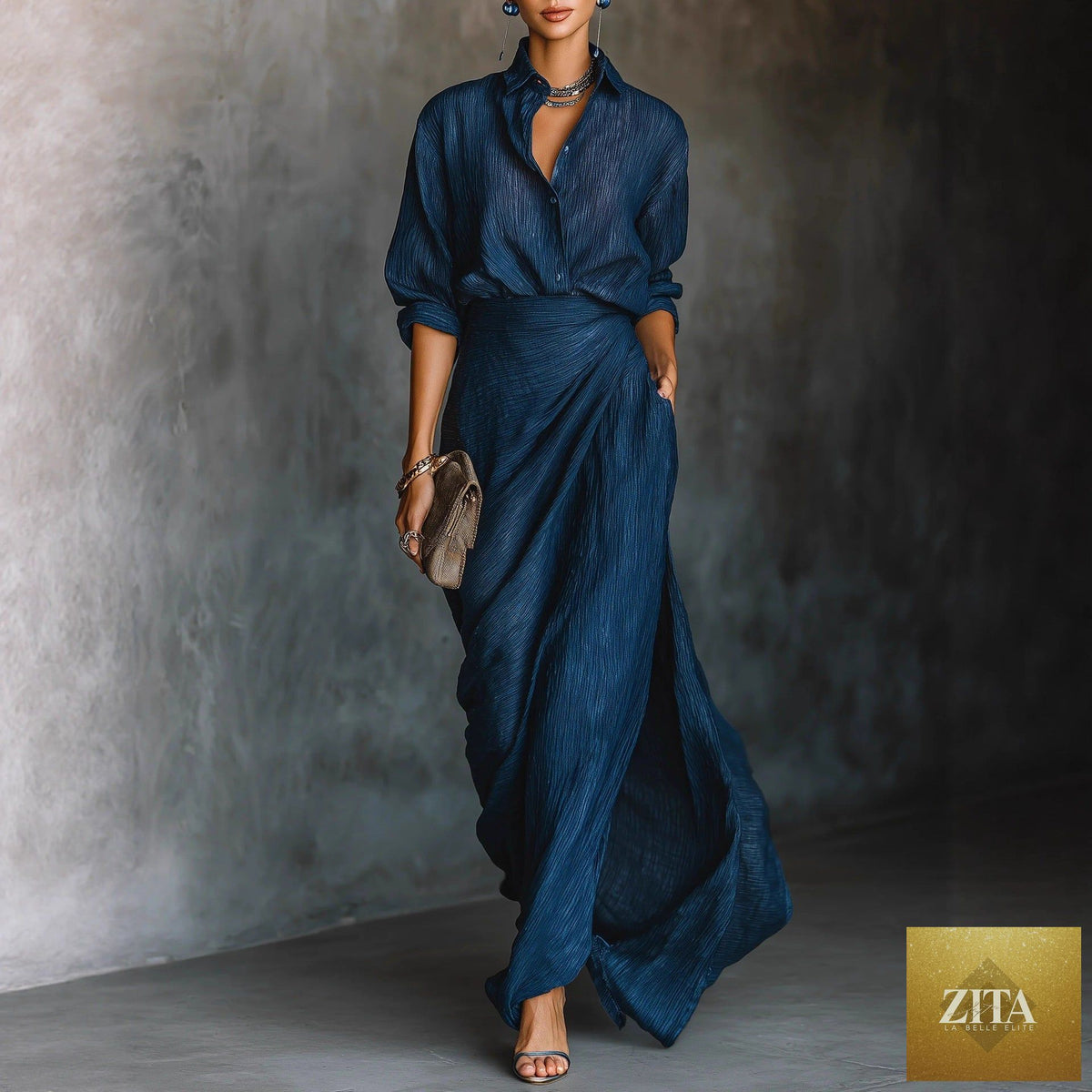 Women's two-piece pleated shirt and wrap maxi skirt set by FitiqueFit, featuring long sleeve button top and flowing skirt.