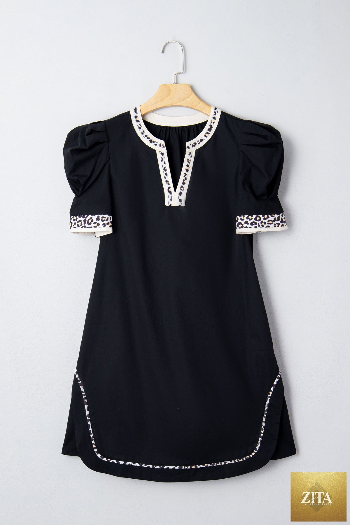Black leopard trim notched neck short puff sleeve mini dress from Wild and Free Boutique, featuring a stylish shift silhouette.
