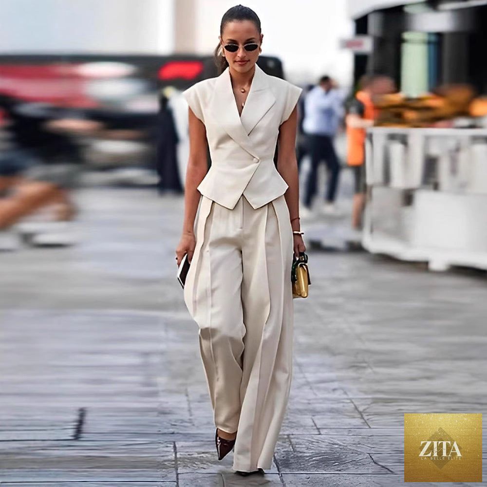Elegant women's sleeveless waist-cinching two-piece suit set by Zita La Belle Elite, featuring a fitted top and matching skirt.