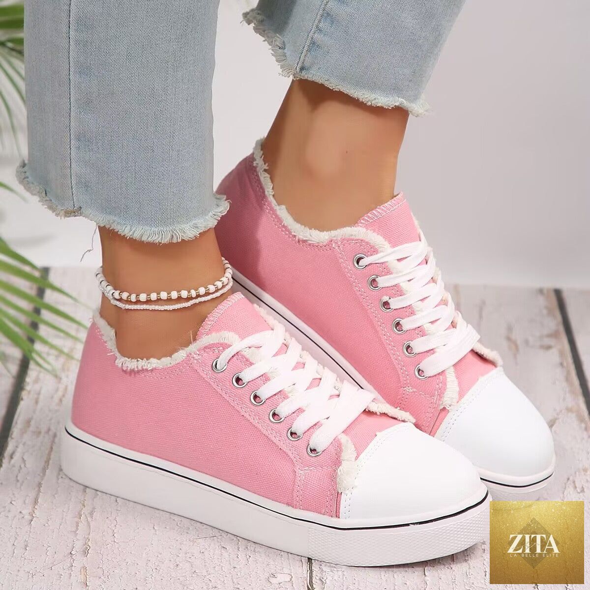 Women's lightweight lace-up canvas sneakers by FitiqueFit, flat low-top footwear with breathable fabric and stylish design.