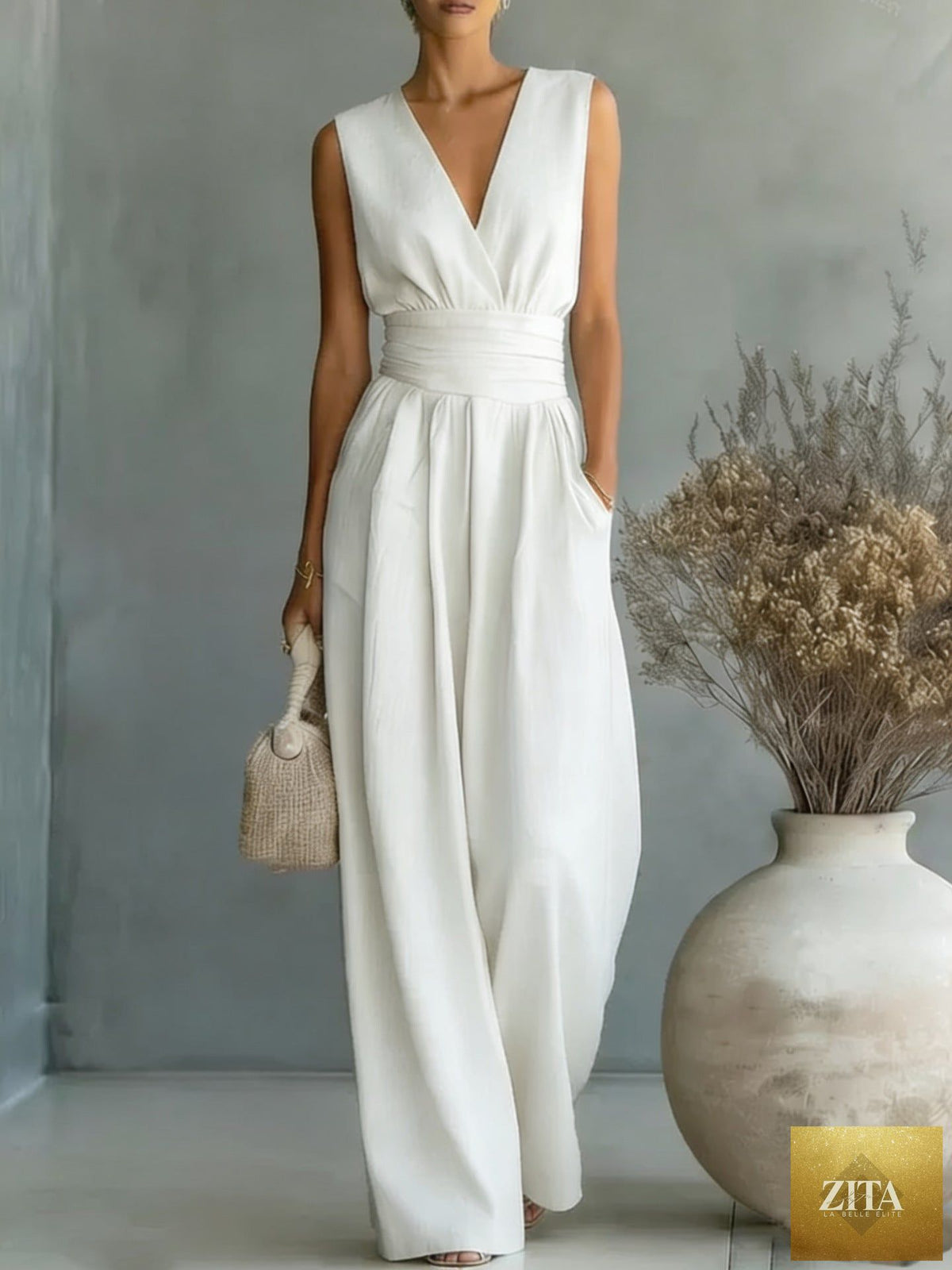 Women's elegant V-neck sleeveless jumpsuit by Zita La Belle Elite featuring a waist-cinching fit and straight-leg casual style.