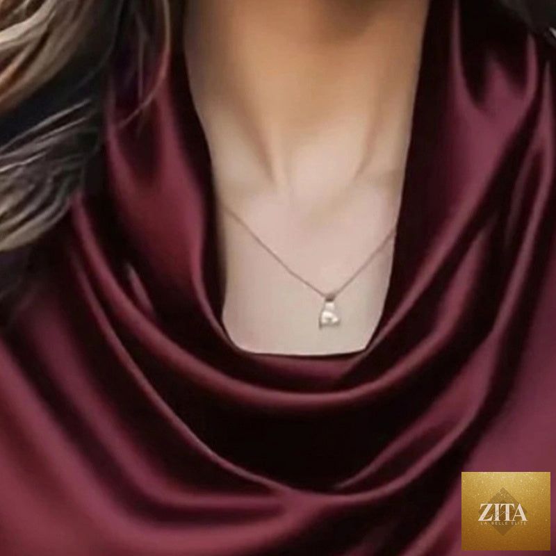 Women's elegant draped neck blouse by FitiqueFit, casualwear style, showing the flowing fabric and sophisticated neckline.