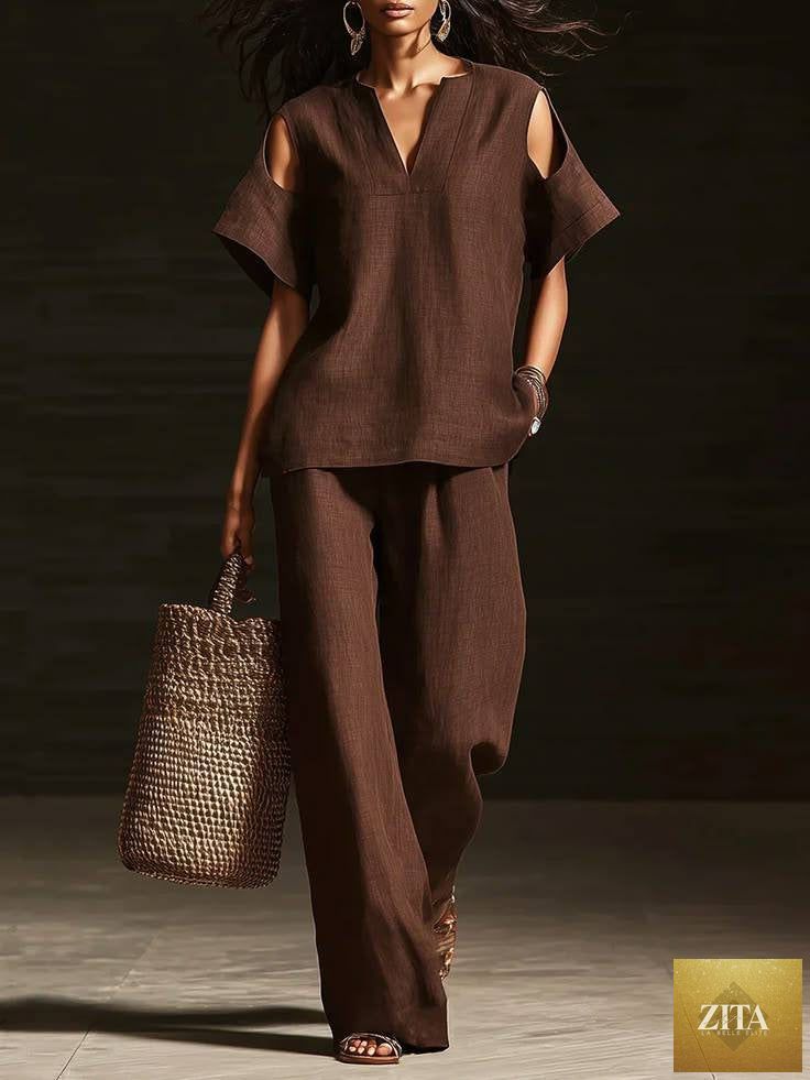 Zita La Belle Elite two-piece V-neck short sleeve top and straight-leg pants set with ripped detail and pockets, solid color.