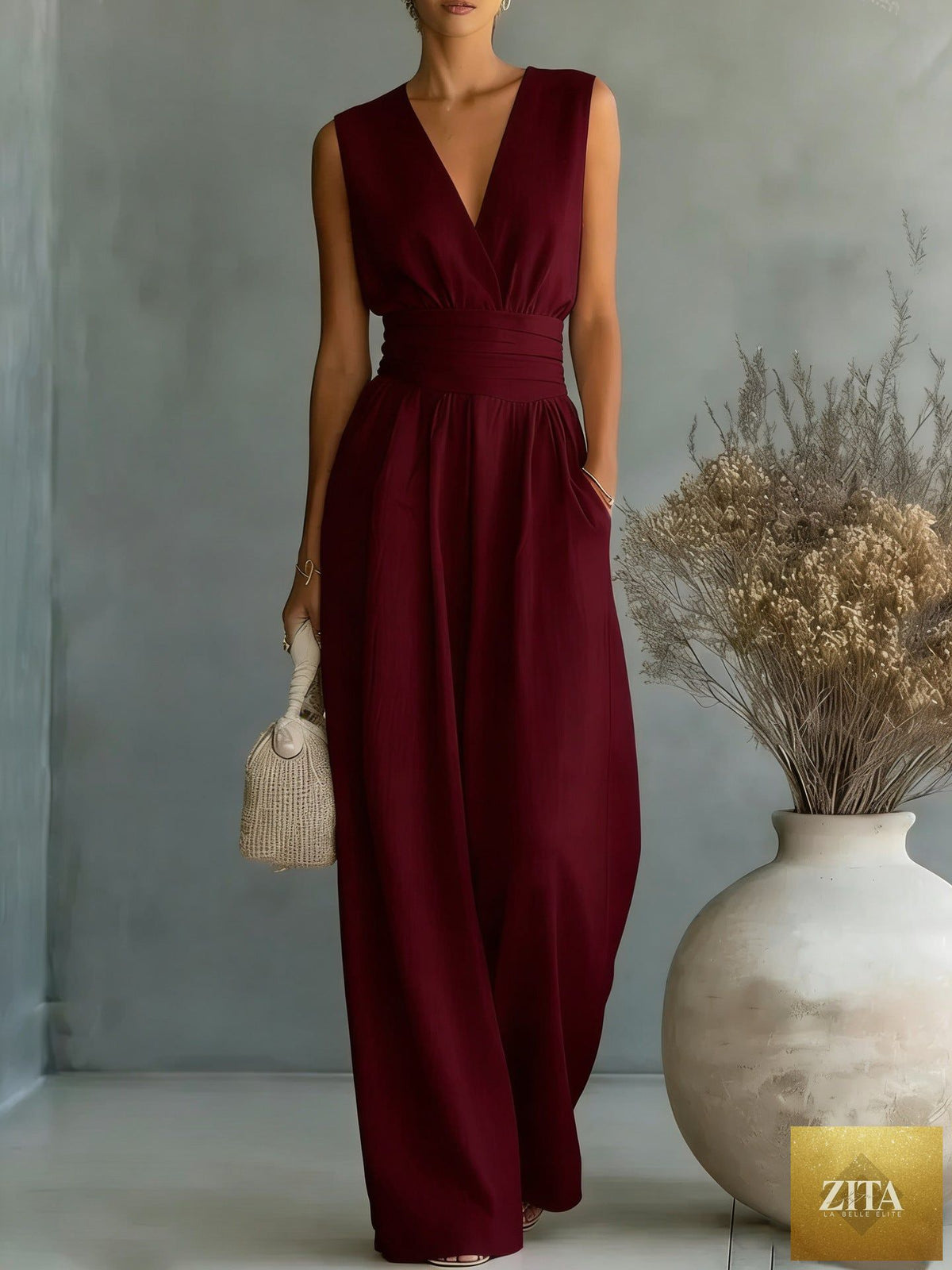 Women's elegant V-neck sleeveless jumpsuit by Zita La Belle Elite, featuring a waist-cinching fit and straight leg casualwear style.