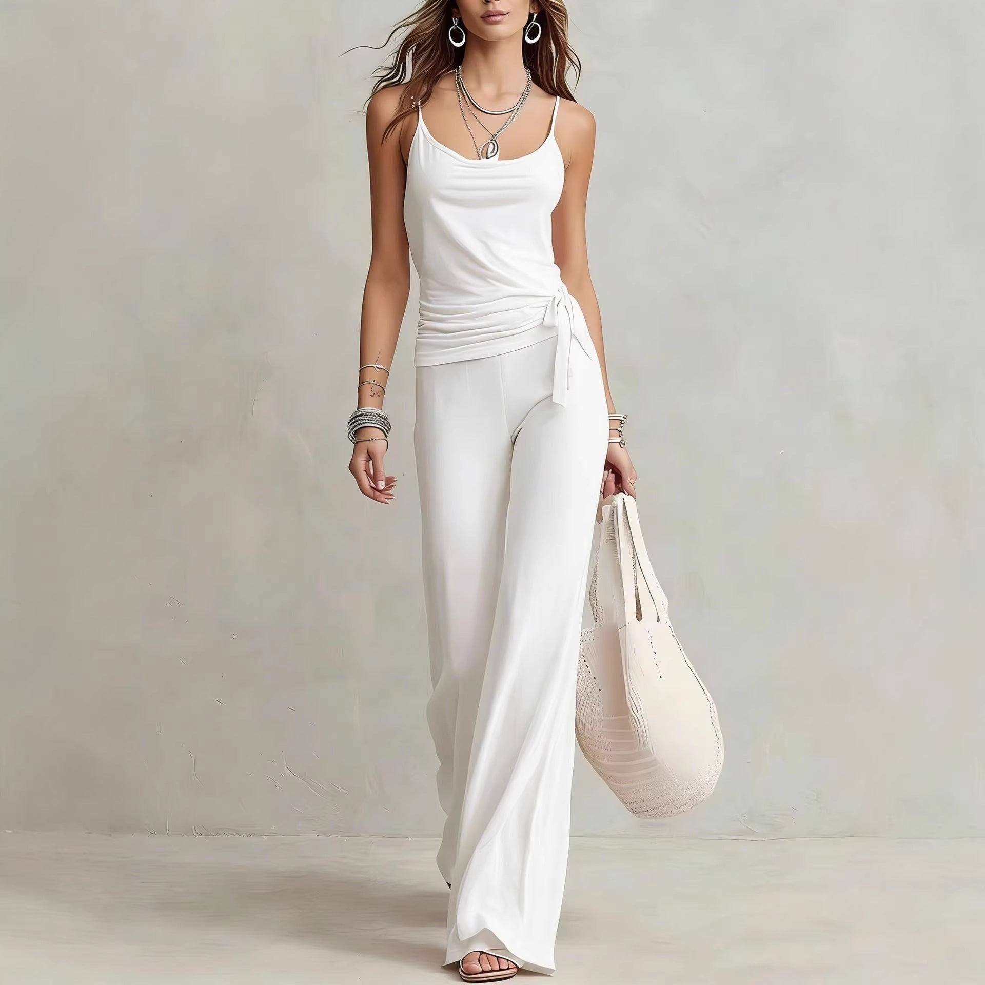 Women's casual sleeveless top and pants two-piece set by FitiqueFit, featuring solid color and comfortable fit.