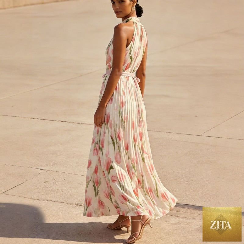 Women's halterneck high-waist swing dress by FitiqueFit featuring floral and solid print casualwear, shown in a flowing, stylish design.