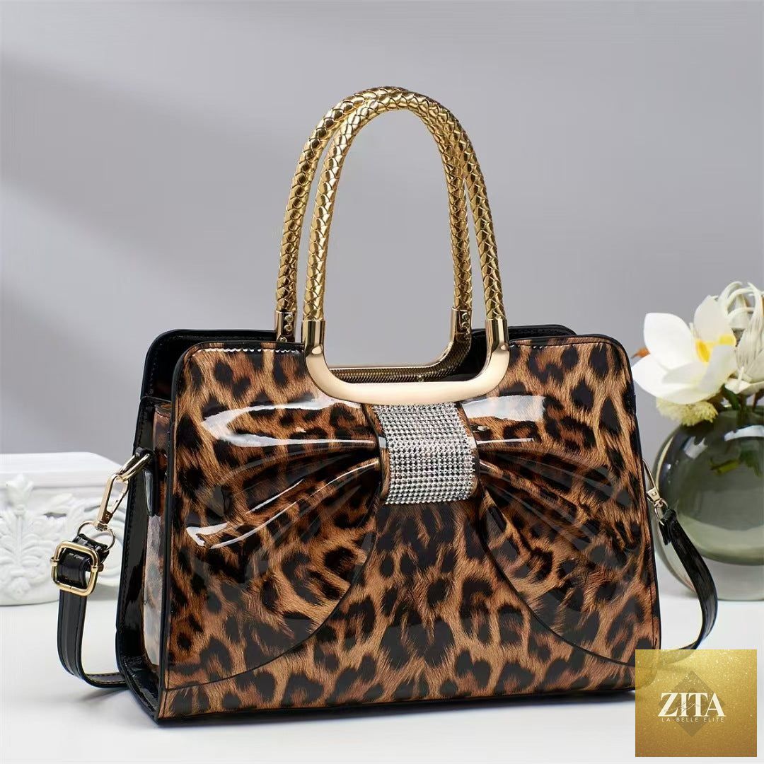 Elegant genuine leather handbag with leopard print and hot-stone embellishments, versatile and chic for women.