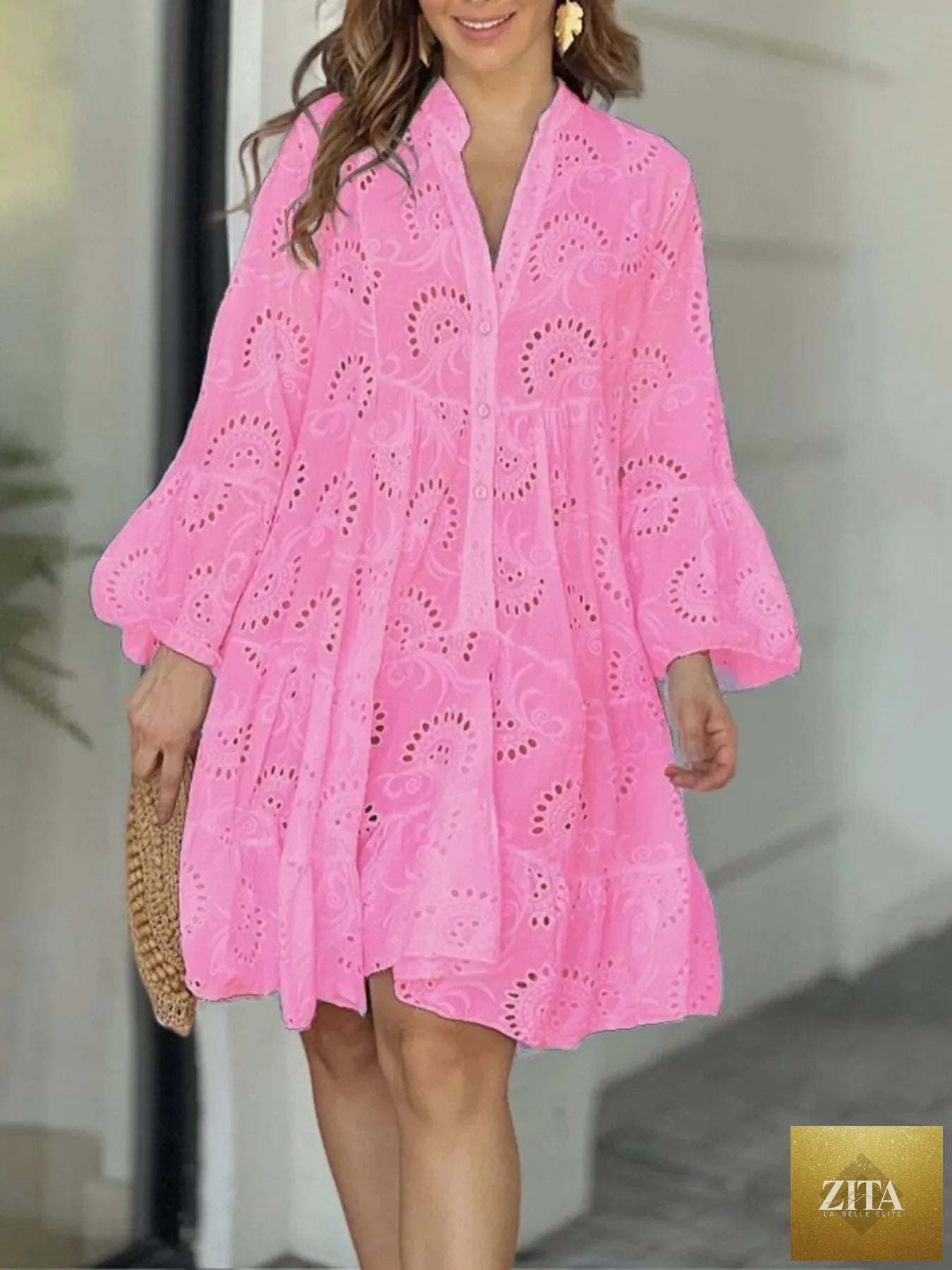 Eyelet ruffled hem tiered dress by Shopiebay featuring sleeveless design and floral embroidery, perfect for summer occasions.