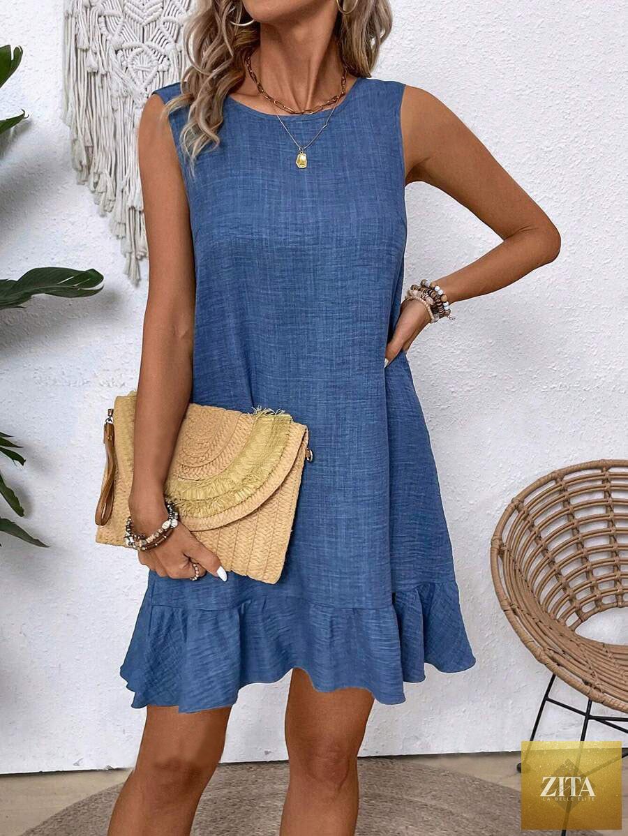 Women's ruffle lace-up mini dress by FitiqueFit featuring short sleeves and a loose, beach-ready design.