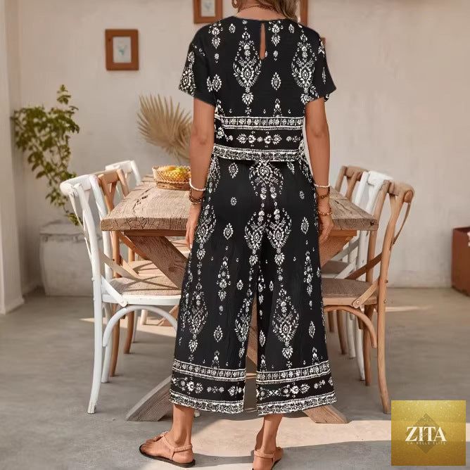 Women's ethnic print casualwear two-piece set with a top and straight-leg pants by Zita La Belle Elite, featuring vibrant contrast patterns.