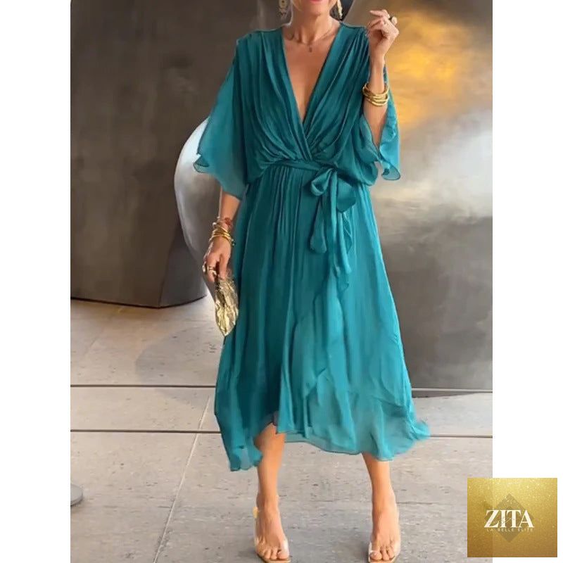 FitiqueFit Batwing Sleeve V-Neck Midi Dress with tied irregular hem, flowing fairy dress style, lightweight and elegant for special occasions.