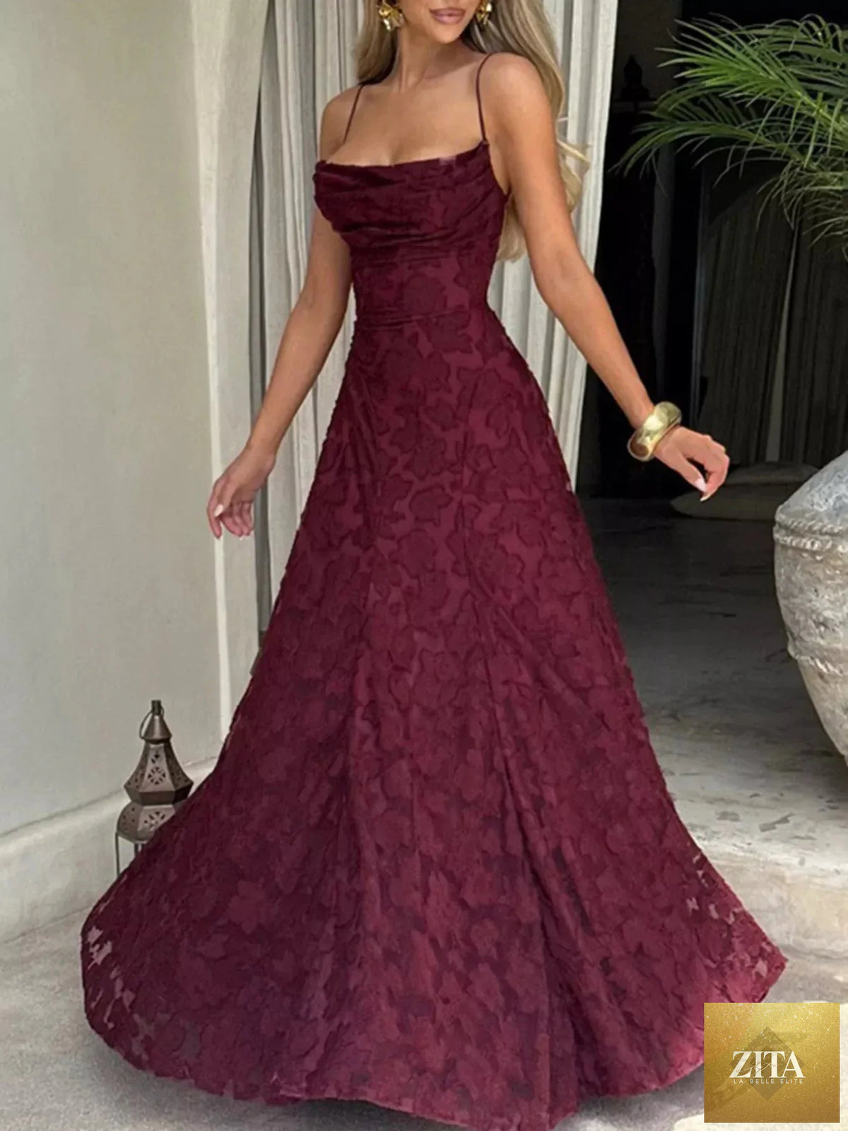 Lace spaghetti strap maxi dress from Shopiebay featuring delicate lace fabric and a flowing silhouette.