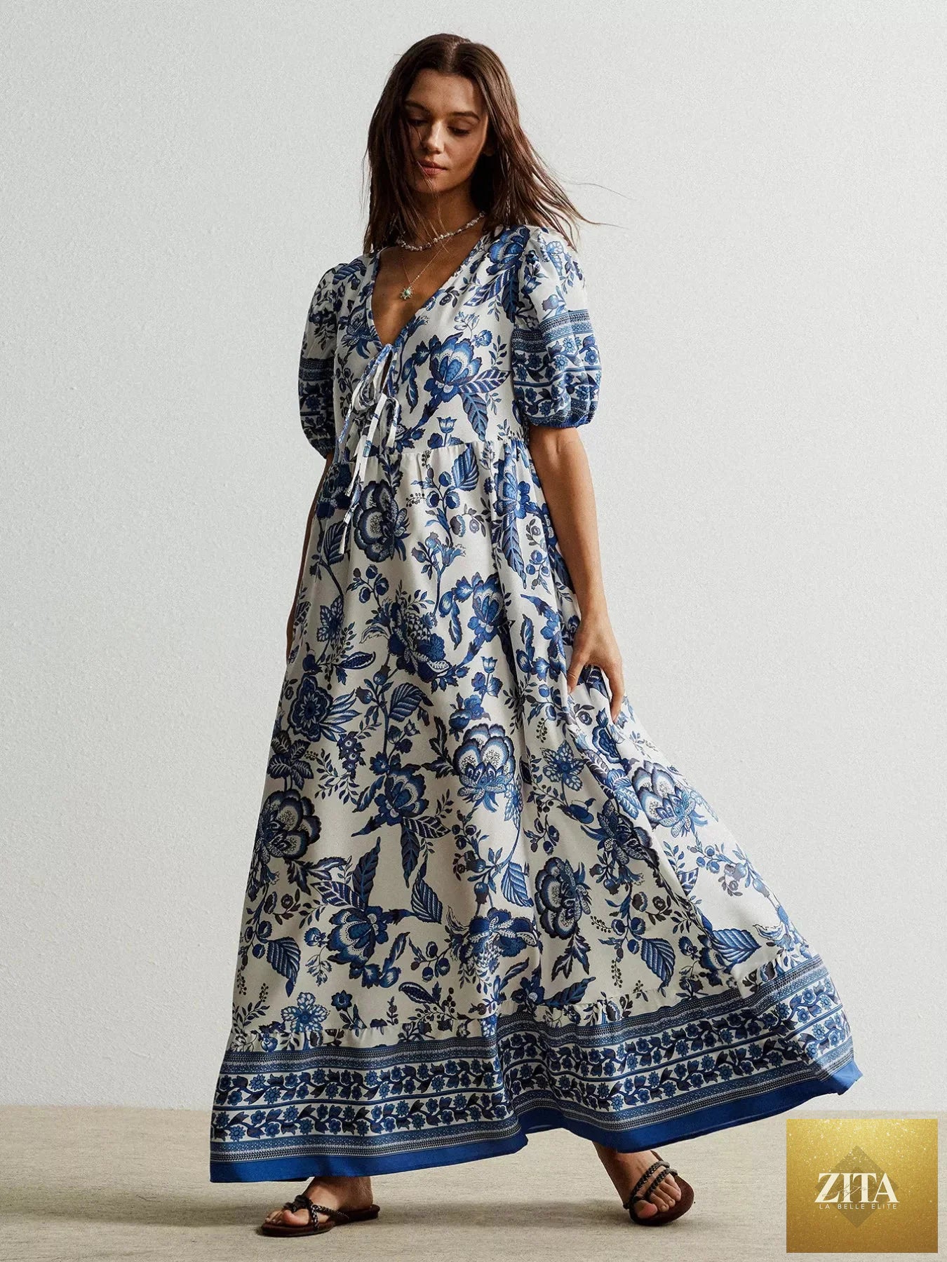 Floral print tie-neck puff sleeve maxi dress by Shopiebay, featuring a flowing silhouette and vibrant floral pattern.