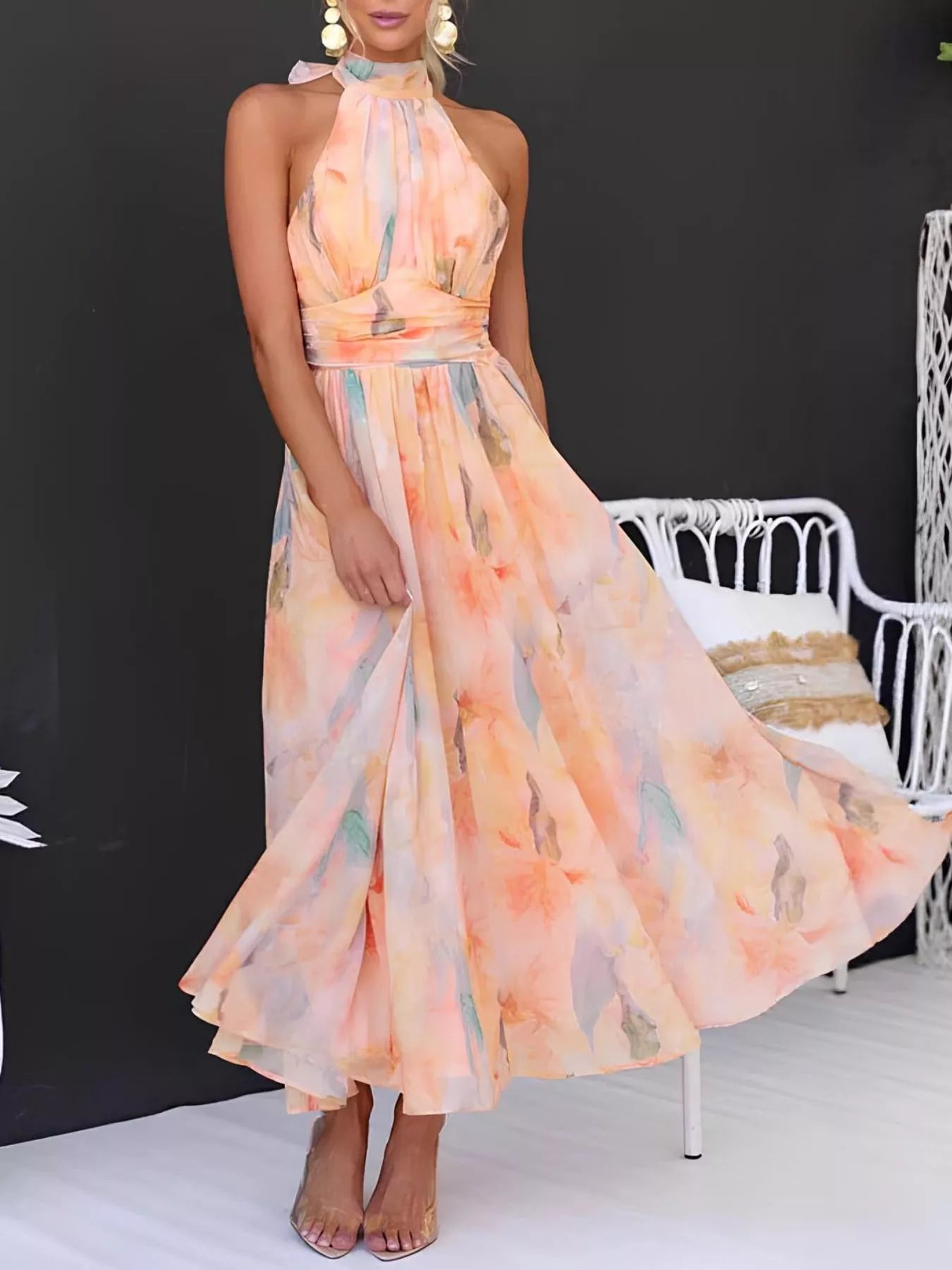 Floral halter neck backless summer dress by Shopiebay, featuring vibrant floral pattern and flowing lightweight fabric.