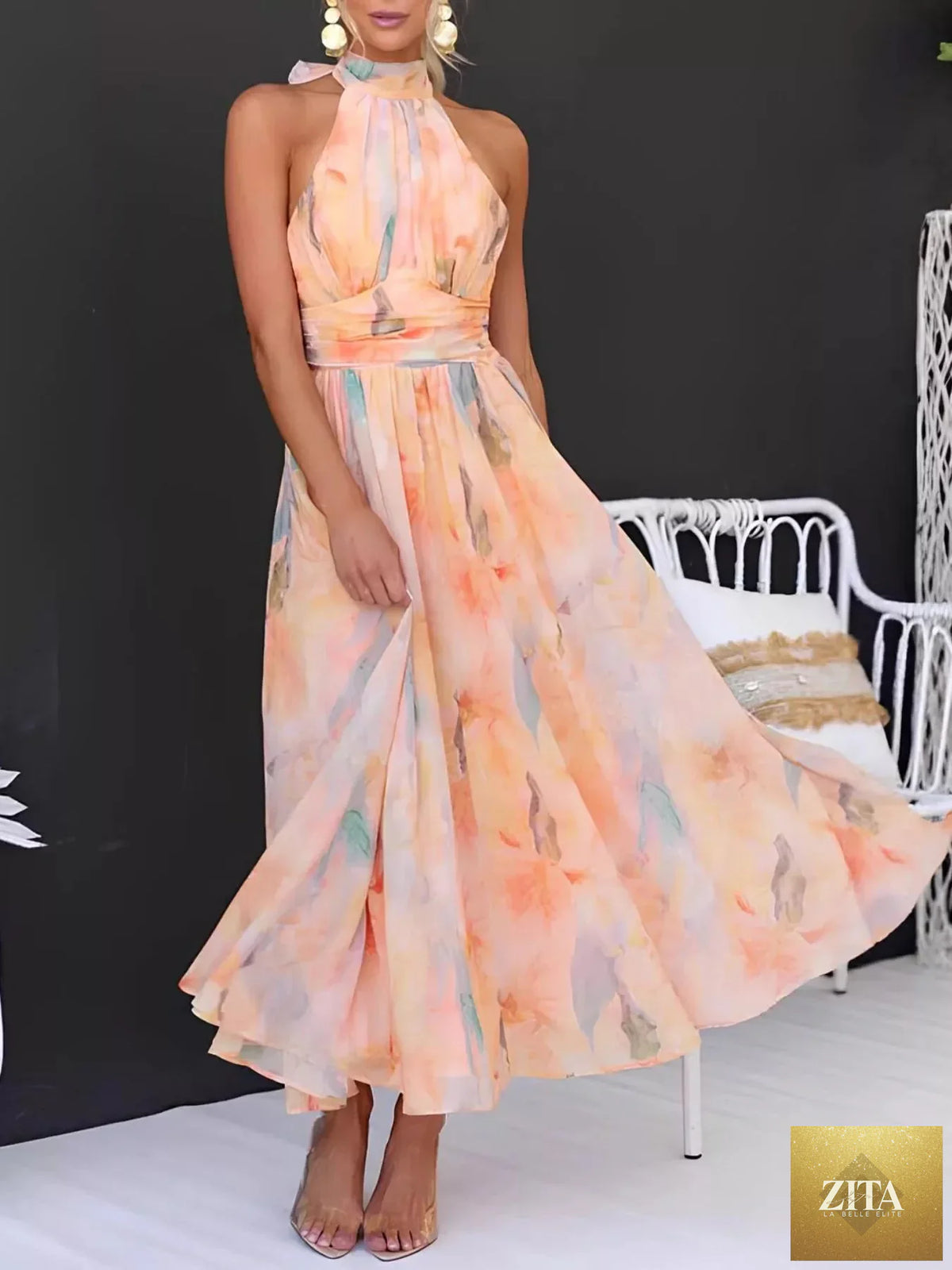 Floral halter neck backless summer dress by Shopiebay, featuring vibrant floral pattern and flowing lightweight fabric.