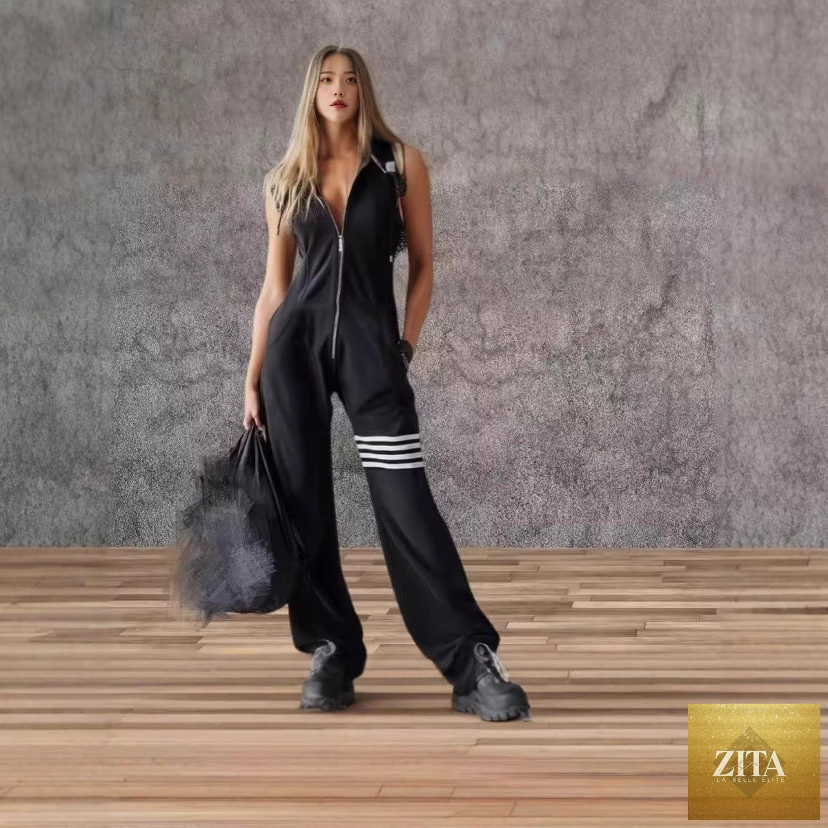 Zita La Belle Elite women's sporty retro sleeveless jumpsuit with hood, striped pattern, lace-up front, and wide flare legs.