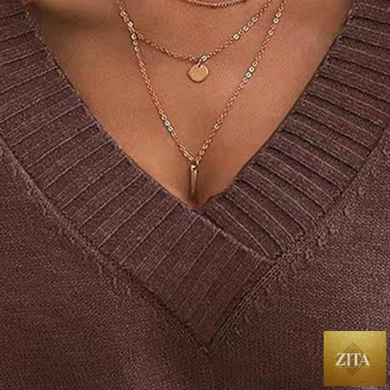 Women’s V-neck drop shoulder sweater by FitiqueFit, casual long sleeve pullover in soft knit fabric, displayed on a neutral background.