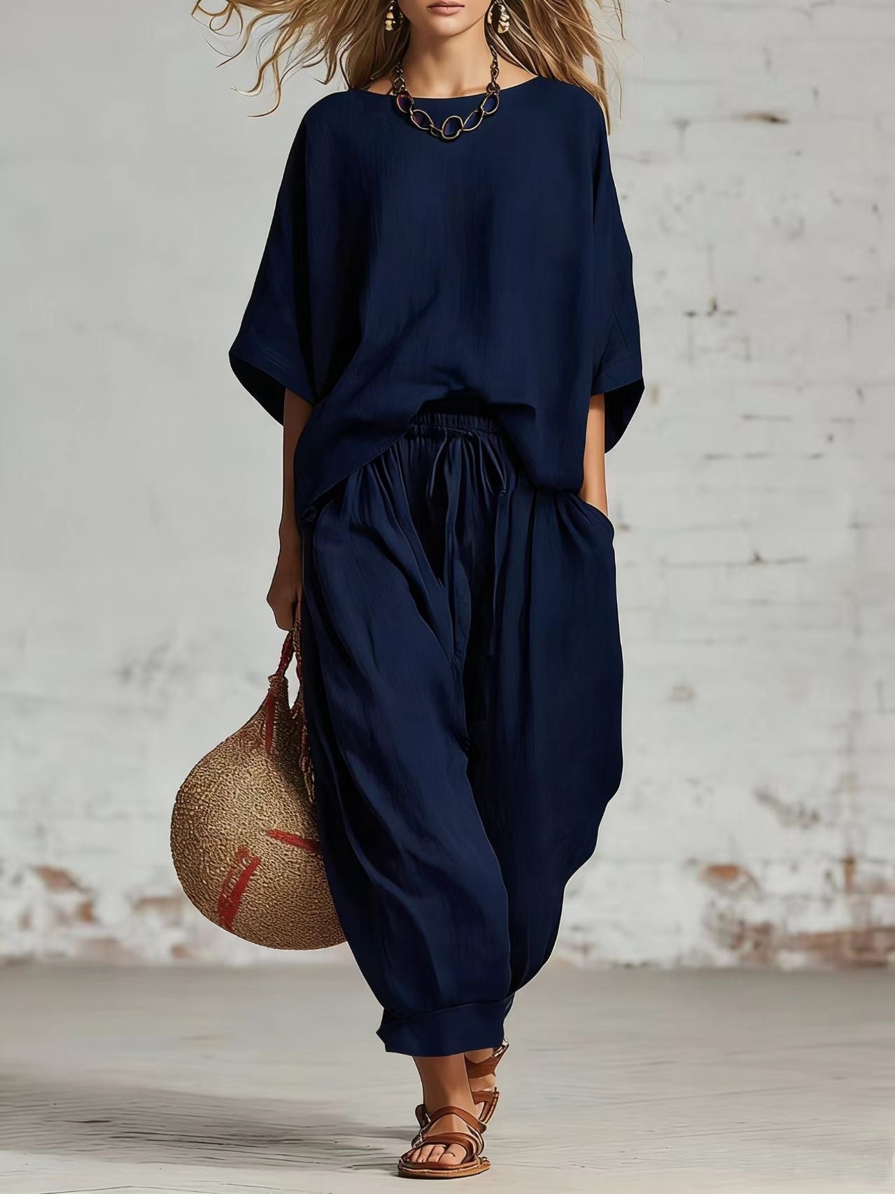 Women’s solid color casual set by FitiqueFit, featuring a loose t-shirt and ankle pants, perfect for comfortable everyday wear.
