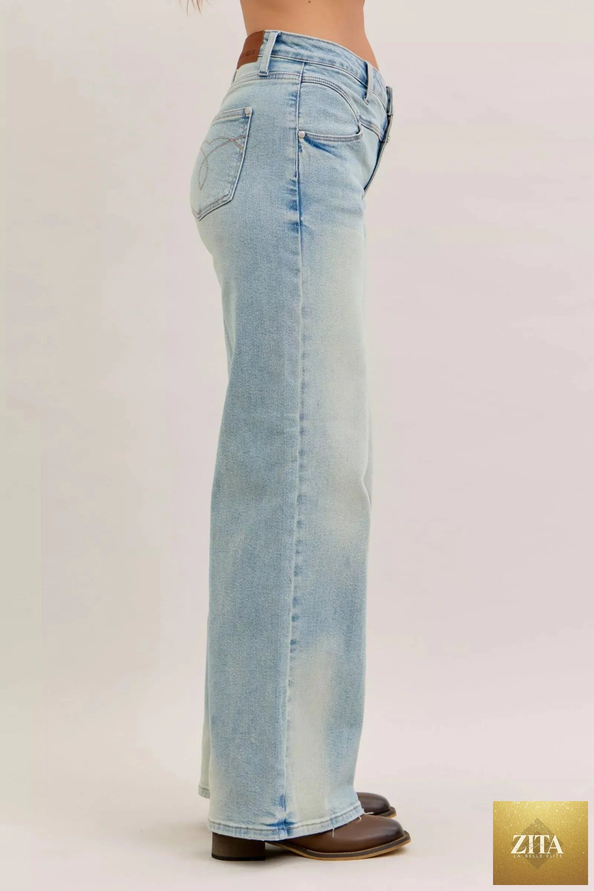Wild and Free Boutique Judy Blue high waist column straight jeans, showcasing their classic denim look and fitted waist design.