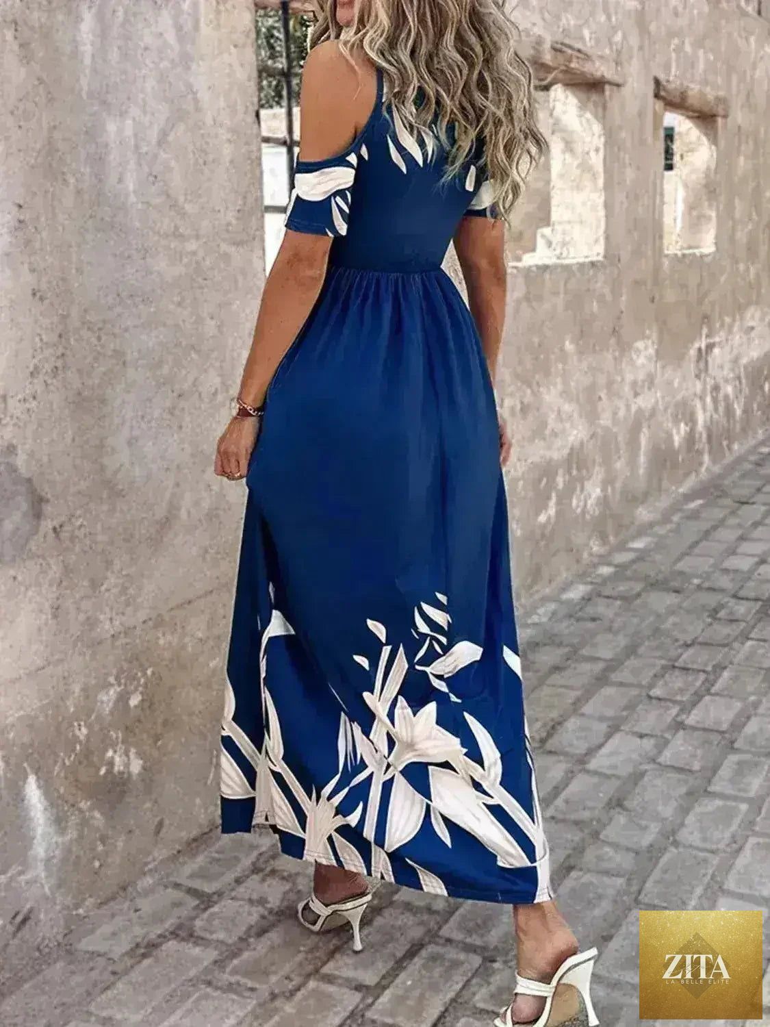 Printed cold shoulder maxi dress for women by Femstylo, featuring stylish polyester fabric and a flowing, elegant design.