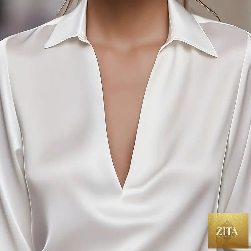 Elegant women's V-neck long sleeve blouse with satin sheen, formal fitiqueFit casualwear, shown on a model in a neutral setting.
