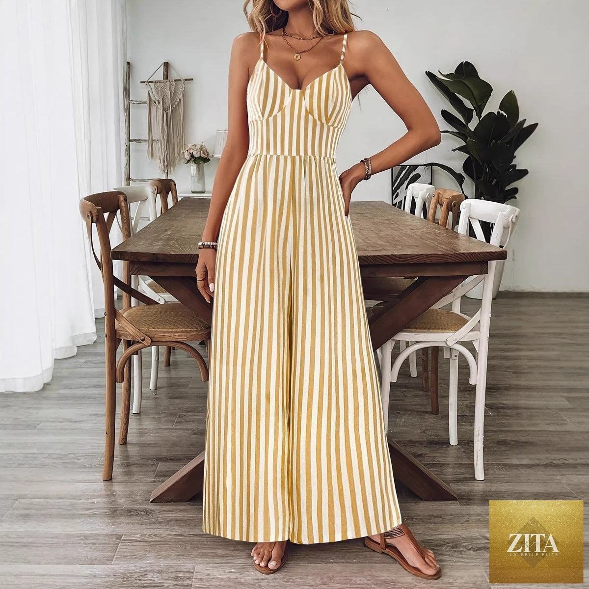 FitiqueFit printed backless sleeveless strap jumpsuit in vibrant ginger yellow, showing front view with adjustable straps and relaxed fit.