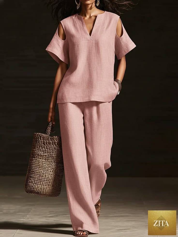 Zita La Belle Elite two-piece set with a V-neck short sleeve top and straight-leg pants featuring ripped details and pockets.