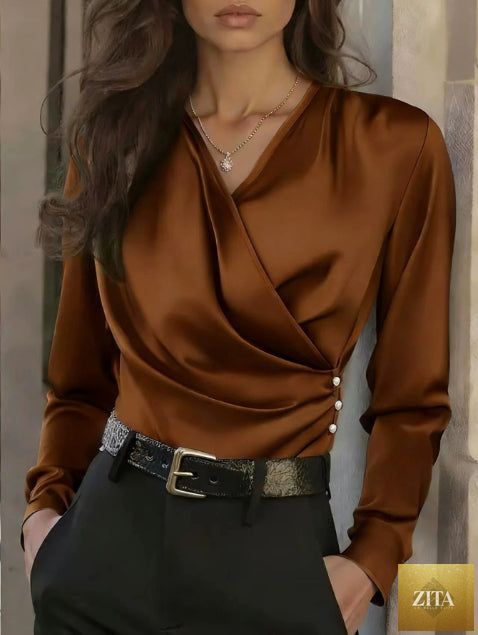 Women's elegant FitiqueFit cross V-neck blouse with ruffle details and button accents, suitable for office casualwear.