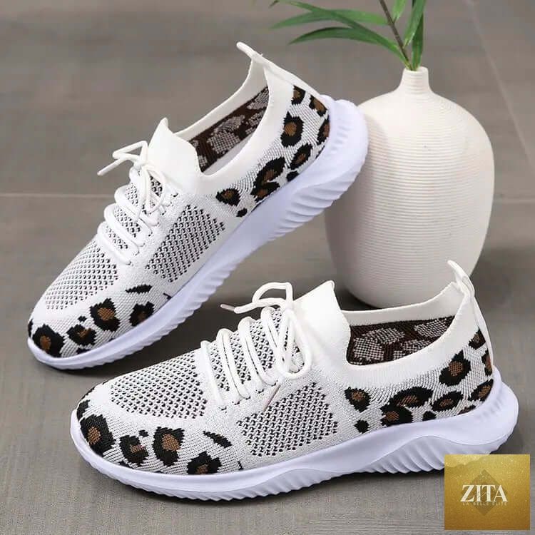 White women's sneakers by SnagBag featuring leopard print accents and lace-up closure, perfect for sporty and casual outfits.