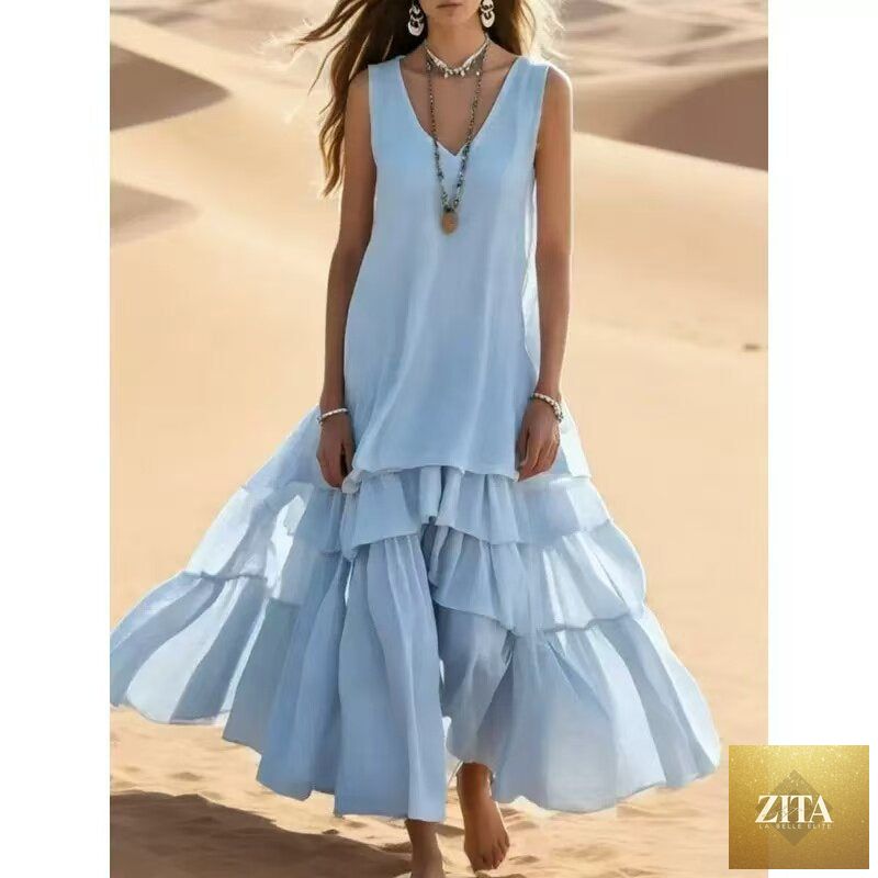 Sleeveless cotton-linen maxi dress with loose umbrella skirt style, from FitiqueFit, shown hanging on a mannequin.