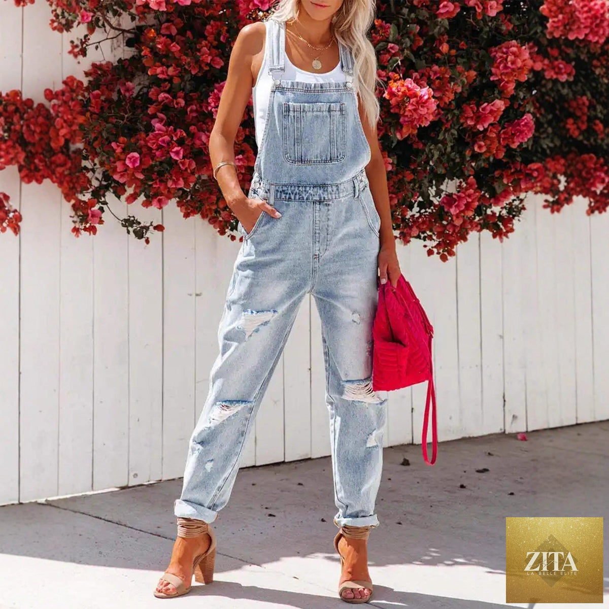 Women's cropped ripped denim overalls by FitiqueFit featuring streetwear strap bib design and distressed details.
