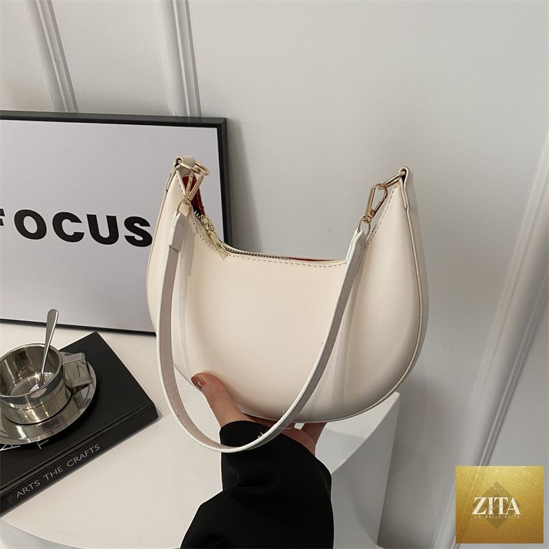 Social Buzz eSIMs Niche Crescent simple textured shoulder bag for women, stylish all-match accessory with modern design.
