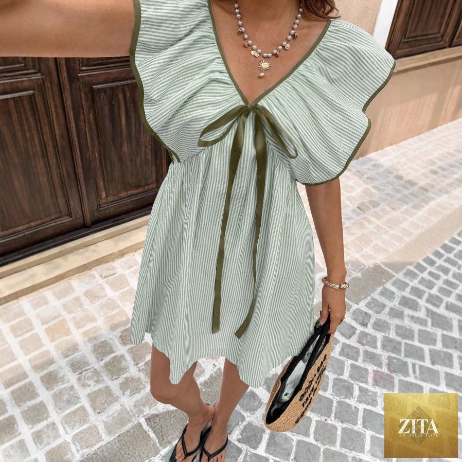 Women's V-neck ruffle puff sleeve mini dress by FitiqueFit, featuring a flirty summer style with lightweight fabric and feminine details.