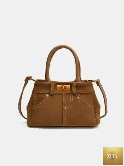 Femstylo stylish suede handbag with adjustable strap and dual-use design, featuring a sleek, modern look and compact size.