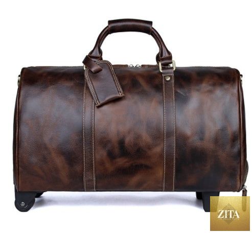 Large capacity cowhide trolley travel bag with sturdy wheels and leather handles, ideal for travel and easy to carry.