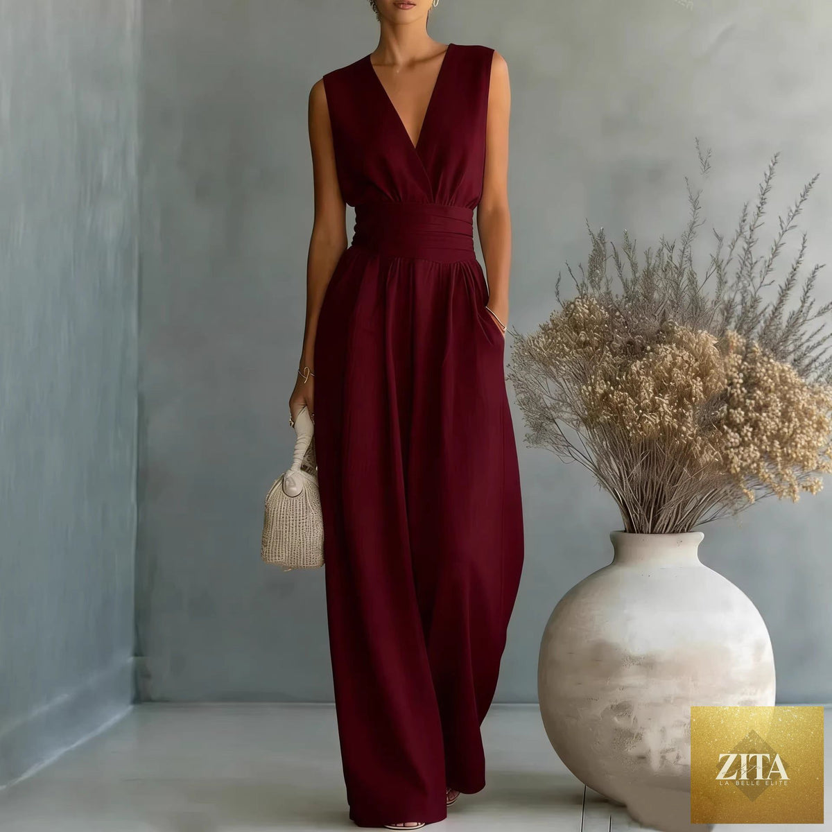 Women's elegant V-neck sleeveless jumpsuit by Zita La Belle Elite featuring a waist-cinching fit and straight-leg casualwear style.