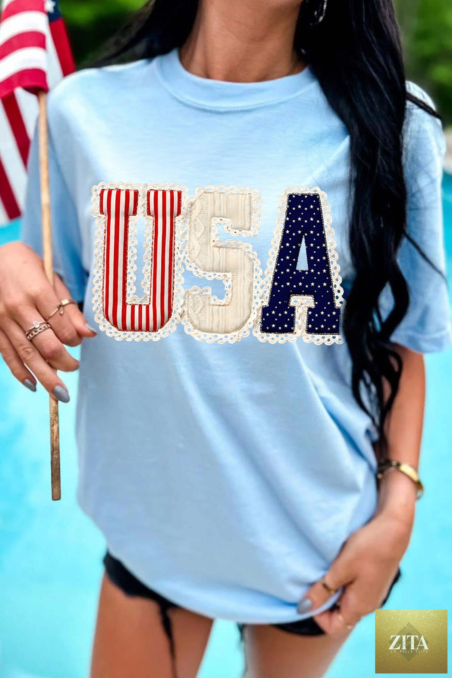 Light blue USA patriotic graphic T-shirt from Wild and Free Boutique featuring stars and flag print, casual and stylish for Independence Day.