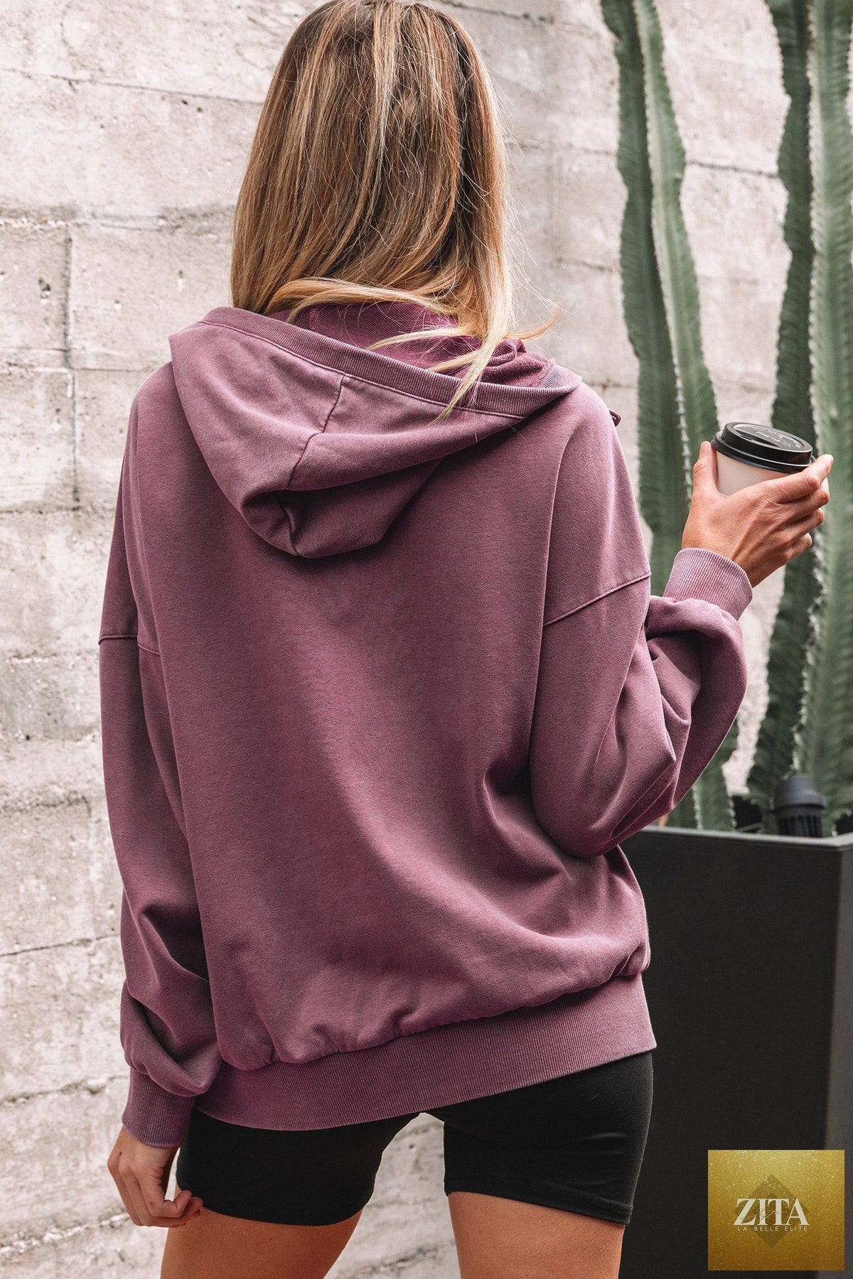 Black half-zip kangaroo pocket mineral wash hoodie from Wild and Free Boutique, baggy fit, casual sweatshirt with soft fabric and relaxed style.