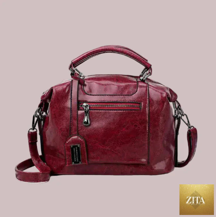 Leather women's handbag with soft tote and crossbody strap, stylish purse by Trendy Attic Store01, showing front view and handle details.