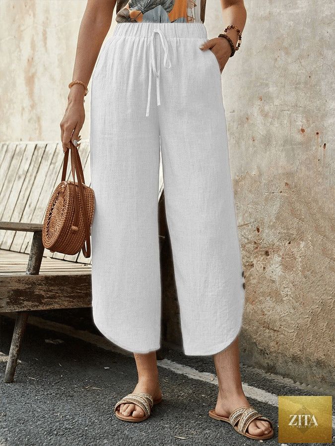 Women's cotton-linen cropped drawstring casual pants by FitiqueFit, shown in a relaxed fit with a drawstring waist and lightweight fabric.