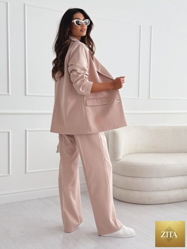 Women's professional blazer and trousers suit set by FitiqueFit, featuring a long sleeve blazer and full-length trousers.
