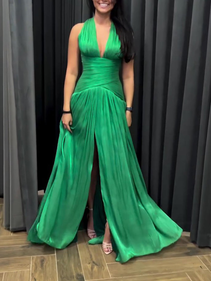 Emerald green plunging neckline gown by The Fashion Celestial with pleated skirt and side slit, elegant evening dress.