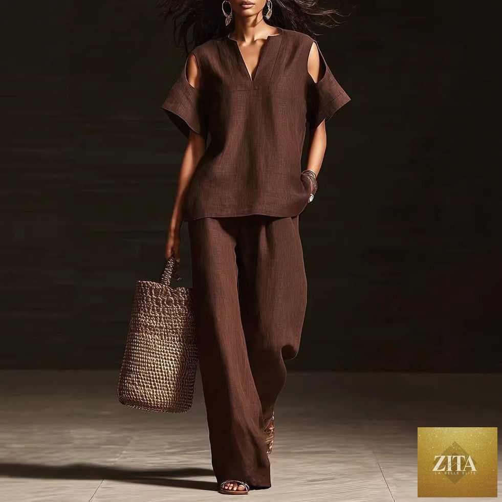Zita La Belle Elite two-piece V-neck short sleeve top and straight-leg pants set with ripped details and pockets in solid color.